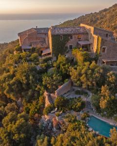 an aerial view of a house on a hill with a pool at Son Rullan in Deia