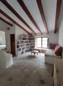 a living room with a couch and a table at Son Rullan in Deia