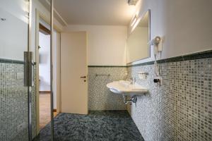 a bathroom with a sink and a mirror at B&B Soggiorno Battistero in Florence +105 photos