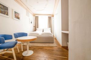 A seating area at Small Luxury Hotel Goldgasse