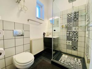A bathroom at Stylish & Cozy Central Studio - Purple Room