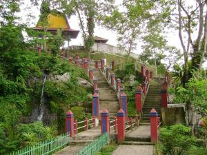 a stairway with red and blue posts and a fence at Joben Eco Park in Tetebatu