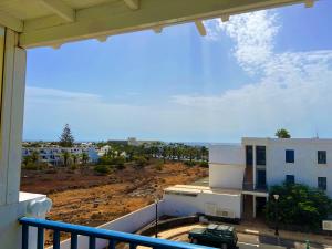 a view from the balcony of a building at LOS CHARCOS TERRACE VIEW in Costa Teguise