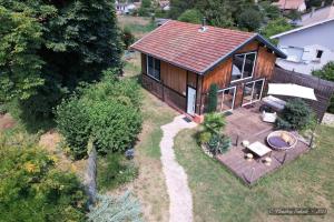 an overhead view of a small house with a deck at Villa Calma - Maison d'hôtes & Spa in Mottier