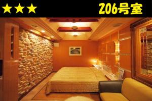 HOTEL Us Bentenbashi Adult onlyにあるベッド