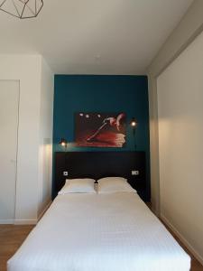 Postel nebo postele na pokoji v ubytování Nemea Appart Hotel Coliseum Amiens Centre