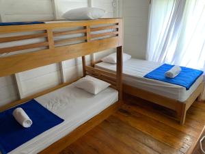 a couple of bunk beds in a room at Crow's Nest in Tua Pejat