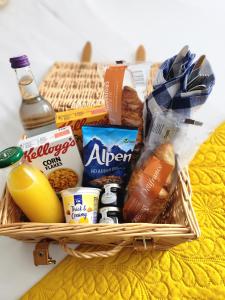 a basket filled with food and other food items at Rooms At The Rosebery in Norwich