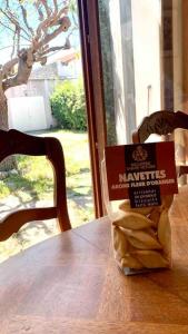 a bag of peanuts sitting on top of a table at Agréable maison provençale avec jardin in Marseille