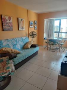 a living room with a couch and a table at Torremar 17 vistas al mar Benidorm in Benidorm