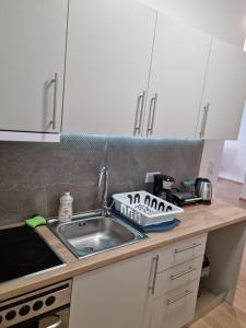 a kitchen with a sink and a counter top at New house in Pireas port in Piraeus
