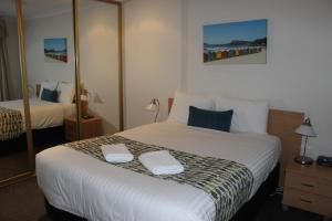 Postel nebo postele na pokoji v ubytování Beaches Serviced Apartments + 37 fotografií