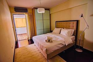 En eller flere senge i et værelse på Athens Plaka Hill luxury Flat