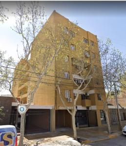a tall building with trees in front of it at Departamento Santa Fe Oeste del Bicentenario in San Juan