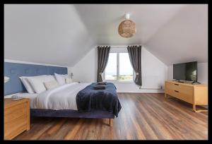 En eller flere senger på et rom på Overcliff Lodge, Mundesley sea view, sleeps 22