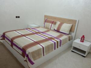 En eller flere senge i et værelse på Appartements ESSALAM 1