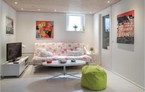 a living room with a couch and a table at Lovely Home In Esbjerg V With Wifi in Esbjerg