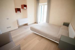 Posteľ alebo postele v izbe v ubytovaní Lazise Boutique Apartment Lago e Relax