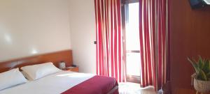 Posteľ alebo postele v izbe v ubytovaní Hotel Ceretto