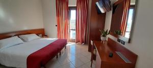 Posteľ alebo postele v izbe v ubytovaní Hotel Ceretto
