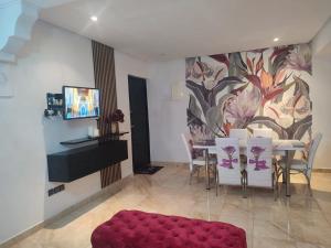 TV a/nebo společenská místnost v ubytování Chez Noufissa