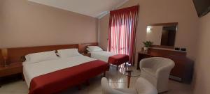 Posteľ alebo postele v izbe v ubytovaní Hotel Ceretto