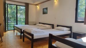 Letto o letti in una camera di B&B Botel Charlie