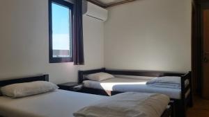 Letto o letti in una camera di B&B Botel Charlie