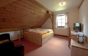 Postel nebo postele na pokoji v ubytování Wellness Hotel Holzberg