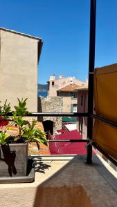 a view from the balcony of a building with plants at Saint-Tropez Centre - Grand Studio avec terrasse in Saint-Tropez