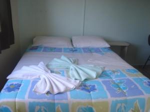 Cama ou camas em um quarto em Hotel Alvorada
