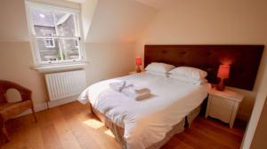 Un ou plusieurs lits dans un hébergement de l'établissement Fire Station Cottage