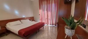 Posteľ alebo postele v izbe v ubytovaní Hotel Ceretto