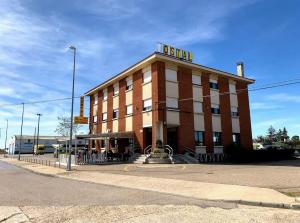 a building with a sign on top of it at HOSTAL ALTO PÁRAMO in Villadangos del Páramo