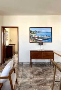 a living room with a tv on the wall at Mahajanga Residences in Mahajanga