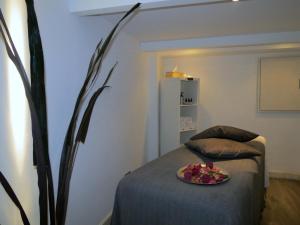 a room with a bed with a plate of fruit on it at BG Nautico Ebeso in Ibiza Town