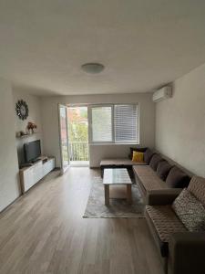 a living room with a couch and a table at Apartment Marija in Ohrid