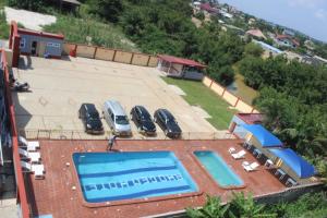 an aerial view of a house with a swimming pool at RHOGEM Hotel in Sekondi-Takoradi