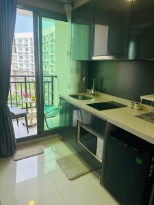 Kuchyň nebo kuchyňský kout v ubytování Arcadia Beach Con