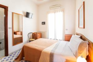 Katil atau katil-katil dalam bilik di Hotel 2 Mari - Vieste