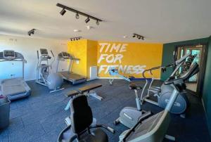 a gym with several exercise bikes in a room at The Hudson @ Silversands in Lossiemouth