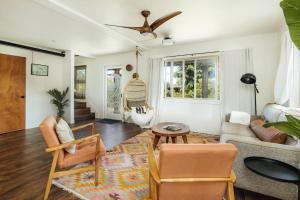 a living room with a couch and a table at The Kumu House in Kailua-Kona