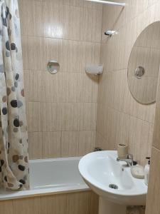 a bathroom with a sink and a shower and a tub at Villa Costa Antigua A3 in Costa de Antigua