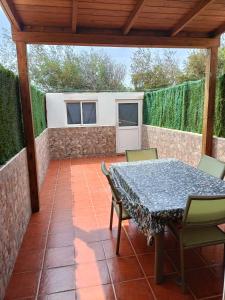 a patio with a table and chairs on it at Villa Costa Antigua A3 in Costa de Antigua