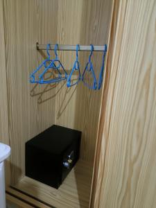 a bathroom with a towel rack and a black box at Villa Costa Antigua A3 in Costa de Antigua
