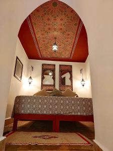 Letto o letti in una camera di Riad Le Coq Berbère