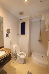 a white bathroom with a toilet and a sink at Ayan ALMUEABADH -1700m to ALharam in Mecca +28 photos