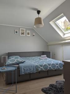a bedroom with a bed and a skylight at 3 Bedroom apartment in the Center of Larochette in Larochette
