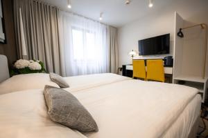 Łóżko lub łóżka w pokoju w obiekcie Hotel Kazimierz