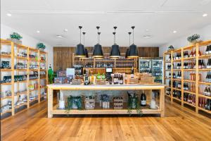 a store with a counter and shelves of alcohol at Las Terrazas de Abama Suites in Guía de Isora